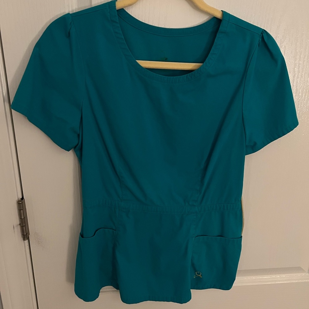 Jaanuu peplum scrub top